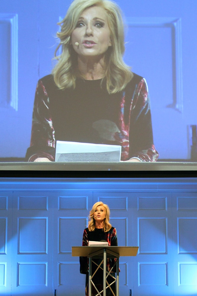 Beth Moore addresses participants at Wheaton College on Dec. 13, 2018, at a summit on sexual abuse and misconduct. RNS photo by Emily McFarlan Miller