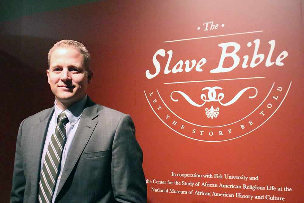 Seth Pollinger, director of museum curatorial, at the Slave Bible exhibit. RNS photo by Adelle M. Banks