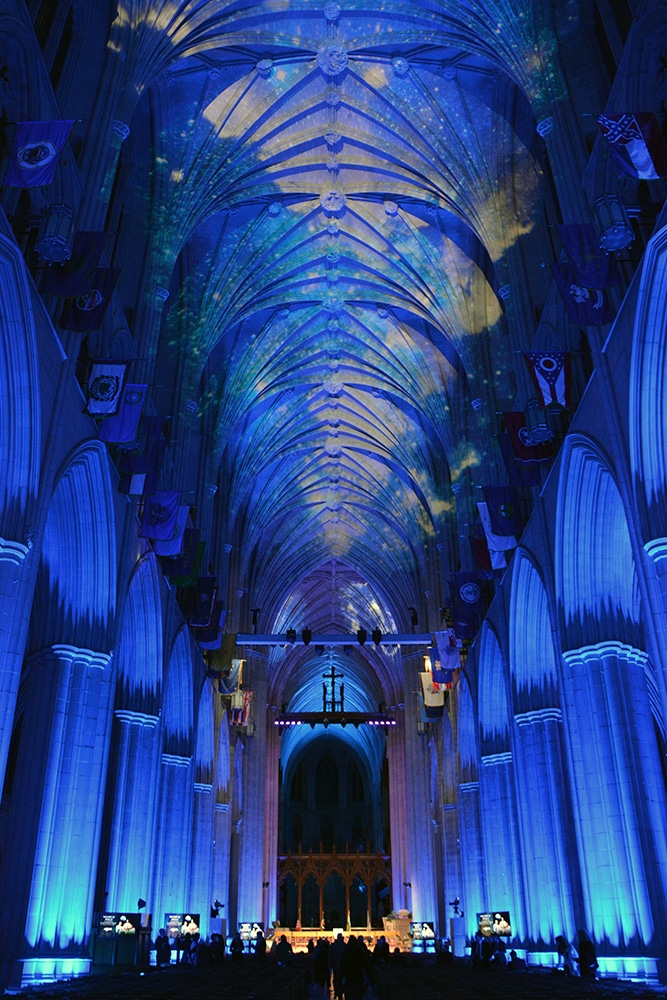 Projectors illuminate the ceiling of the Washington National Cathedral scenes of the cosmos on Dec. 11, 2018. RNS photo by Jack Jenkins
