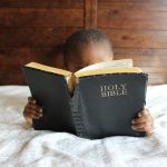 child reading bible