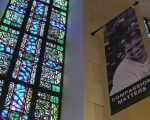 stained glass and compassion banner