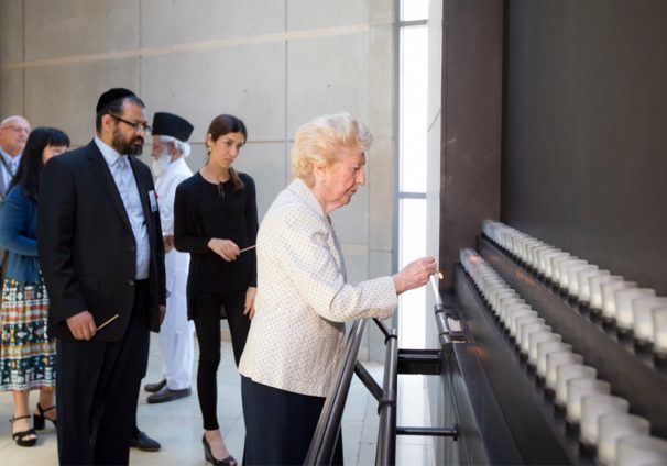 Irene Weiss lights candle