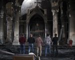 Iraqi Christians pray at church damaged by ISIS fighters