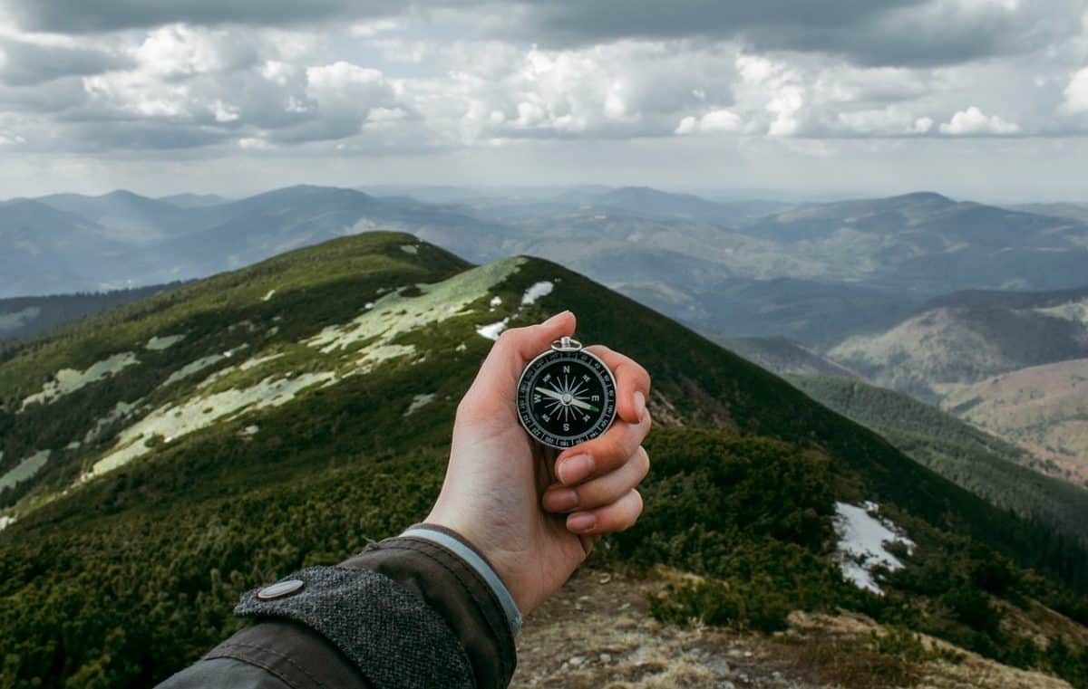 compass and mountains