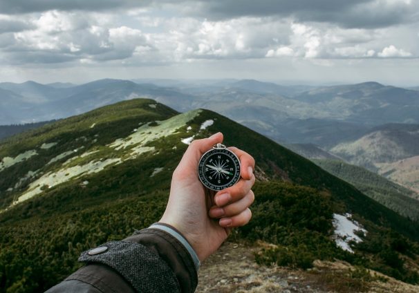 compass and mountains