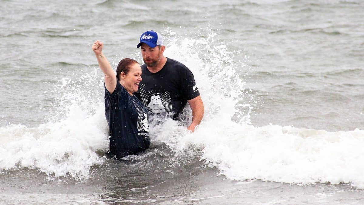 Susie Linnell baptized by pastor Josh Adams
