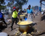 Refugees make maize porridge
