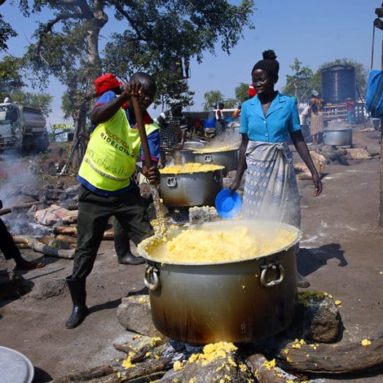 Refugees make maize porridge
