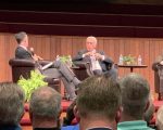 John MacArthur at a panel discussion