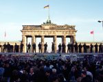 soldiers on Berlin Wall