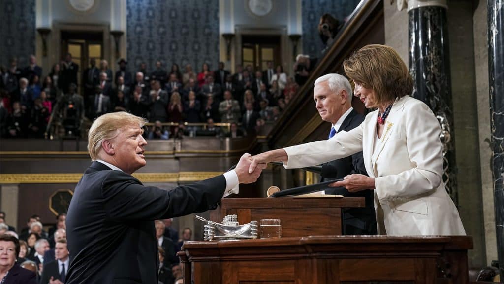 President Donald Trump shakes hands with House Speaker Nancy Pelosi