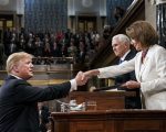President Donald Trump shakes hands with House Speaker Nancy Pelosi