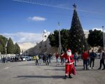 Palestinian wearing a Santa Claus costume