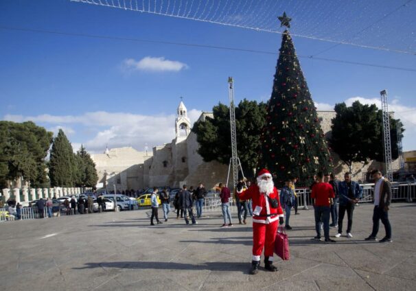 Palestinian wearing a Santa Claus costume