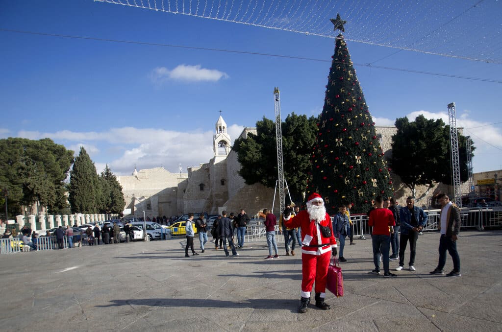 Palestinian wearing a Santa Claus costume