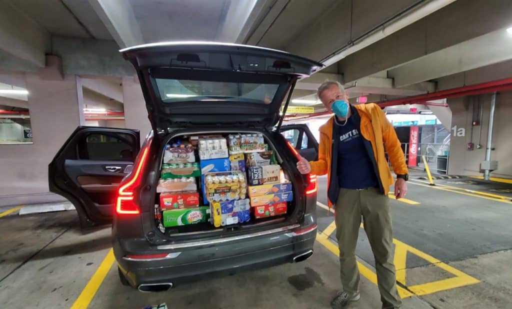Whitney Tilson with carload of food