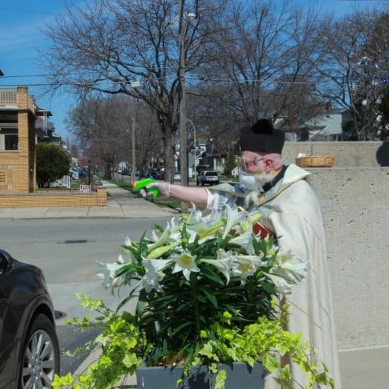 priest with squirt gun
