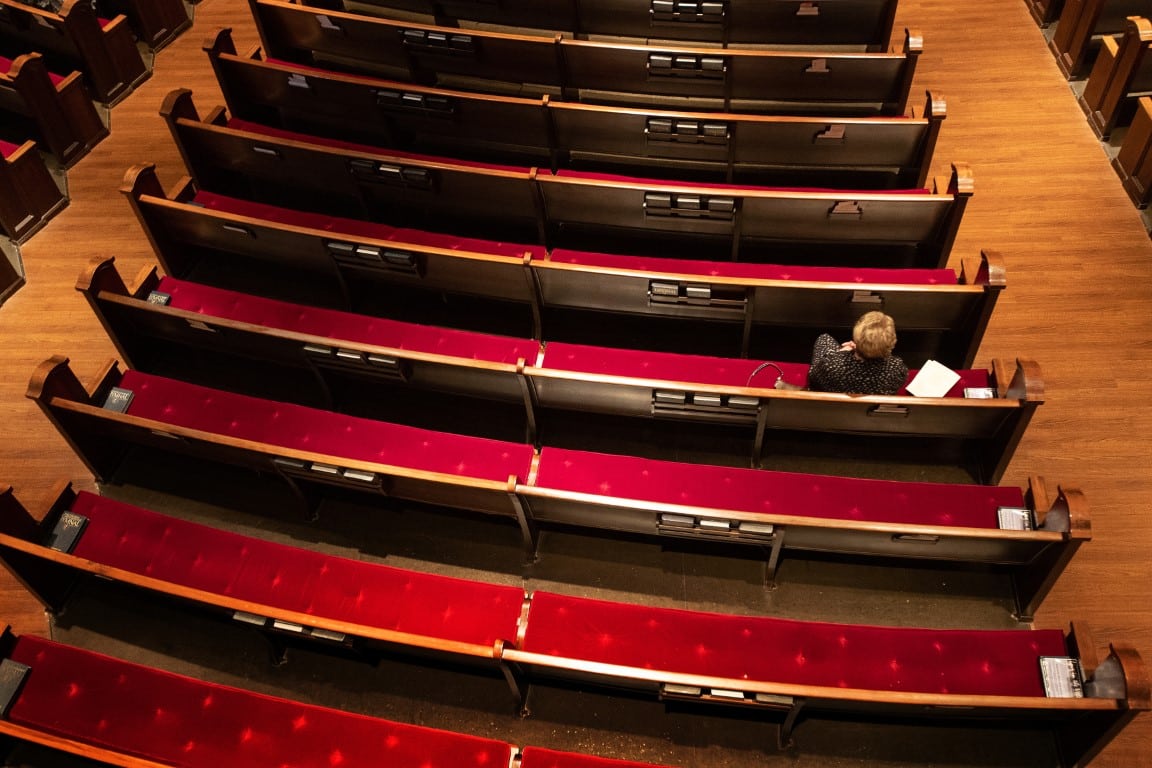 Lone woman in pews