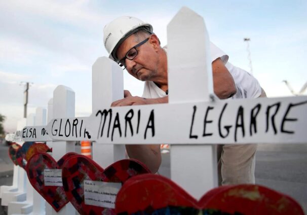 Greg Zanis places crosses