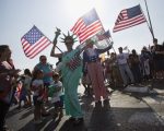 evangelical Christians from various countries wave American flags