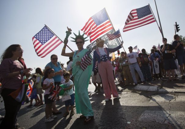 evangelical Christians from various countries wave American flags
