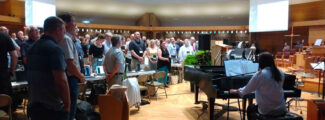 Delegates sing during the Christian Reformed Church annual synod at Calvin University in Grand Rapids, Michigan. (Photo by Ethan Meyers)